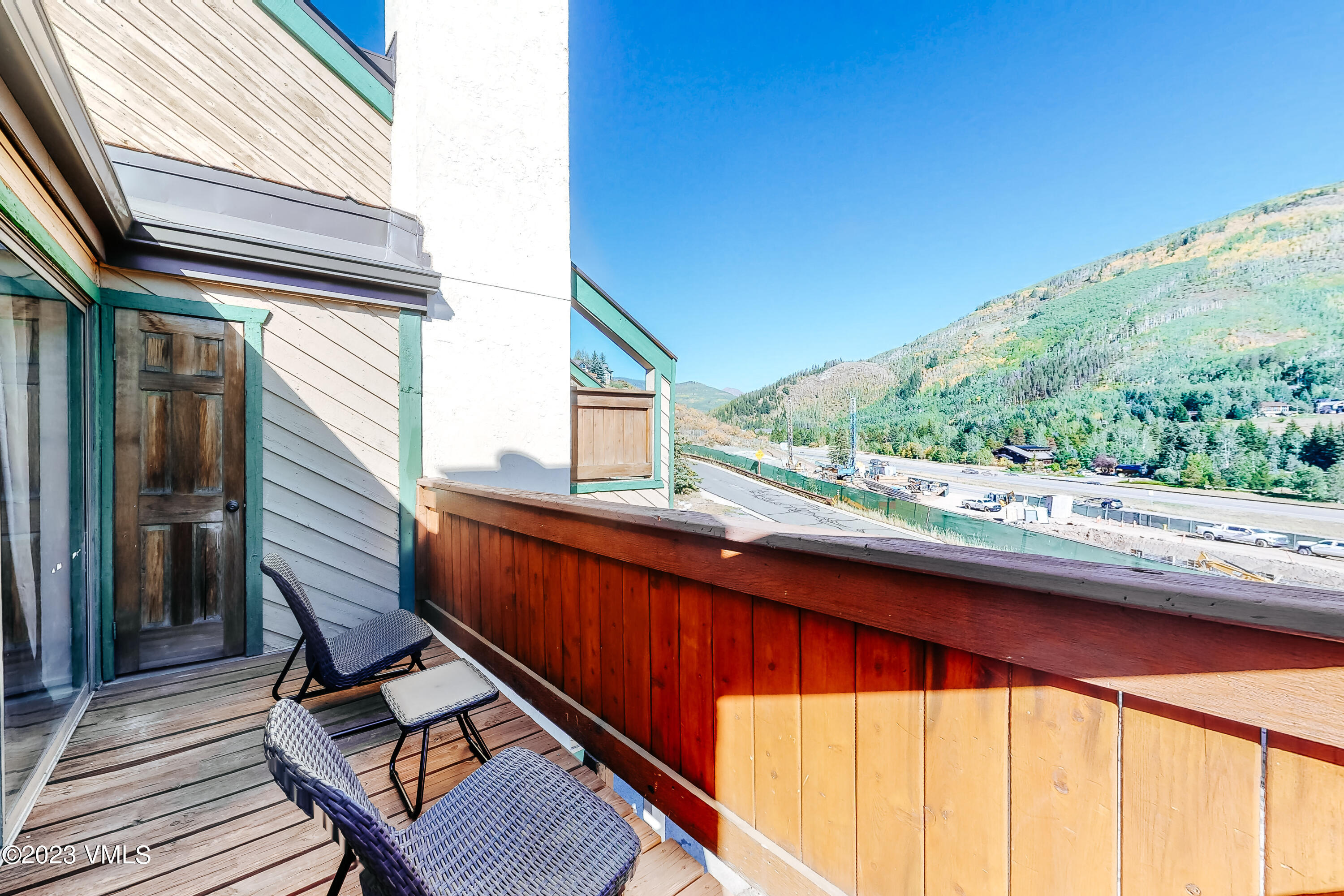 1839 Meadow Ridge Road, Unit D Vail, CO 81657 - Photo 10 of 19 a view of balcony with wooden floor and fence