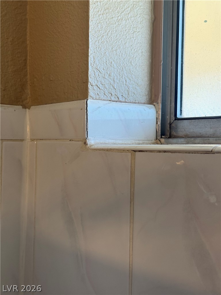 135 Primero Way Henderson, NV 89074 - Photo 15 of 15 Clean tile work and a sun-filled window combine for a fresh space.