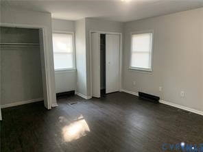 3324 Meadowbridge Road Richmond, VA 23222 - Photo 15 of 36 an empty room with wooden floor and windows