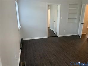3324 Meadowbridge Road Richmond, VA 23222 - Photo 16 of 36 an empty room with wooden floor and closet