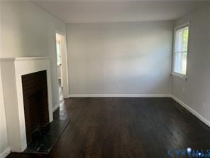 3324 Meadowbridge Road Richmond, VA 23222 - Photo 4 of 36 an empty room with wooden floor and cabinet