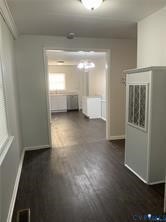 3324 Meadowbridge Road Richmond, VA 23222 - Photo 5 of 36 an empty room with wooden floor and windows