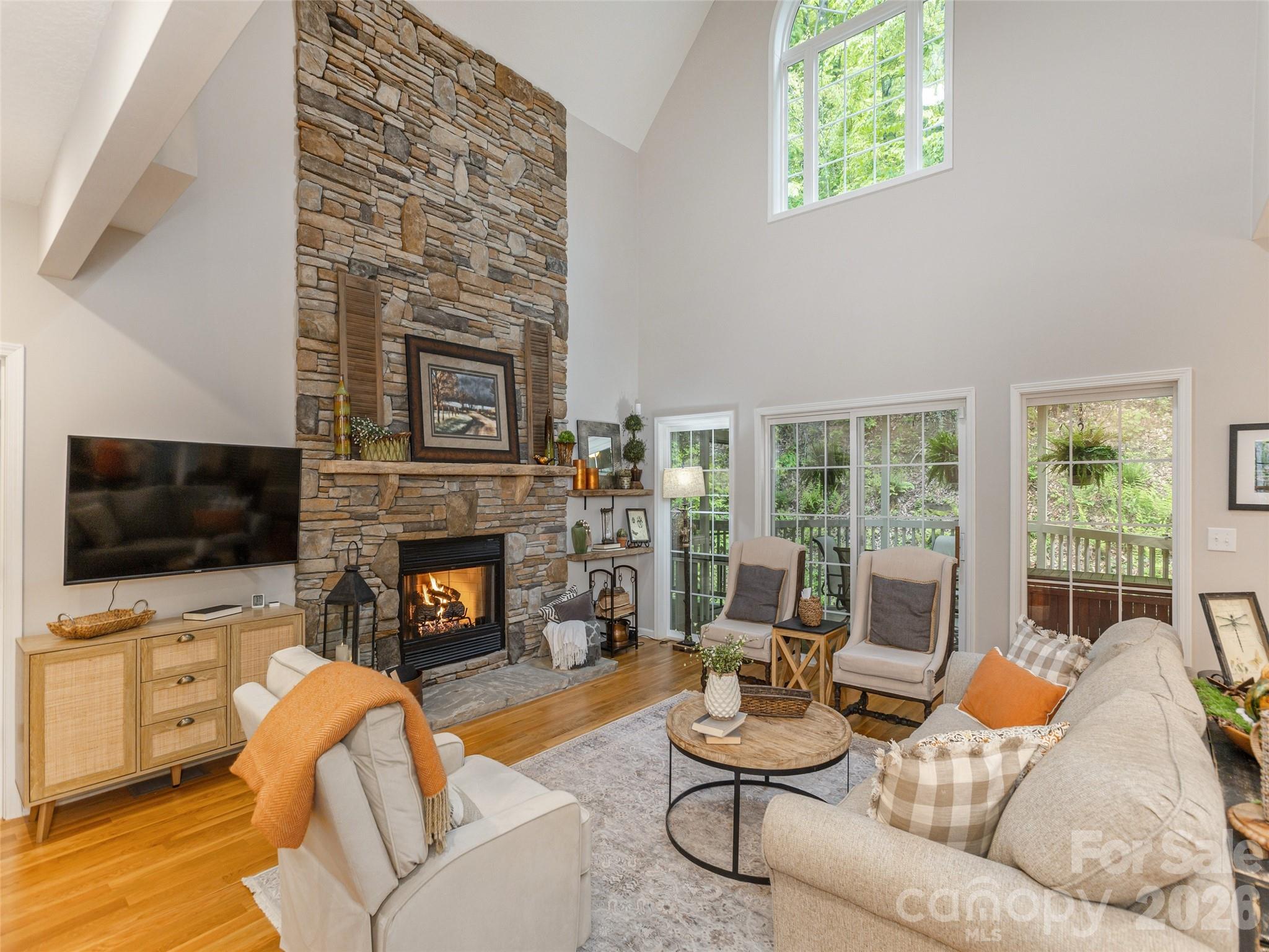 417 Blue Mist Way Arden, NC 28704 - Photo 12 of 48 a living room with furniture a fireplace and a flat screen tv