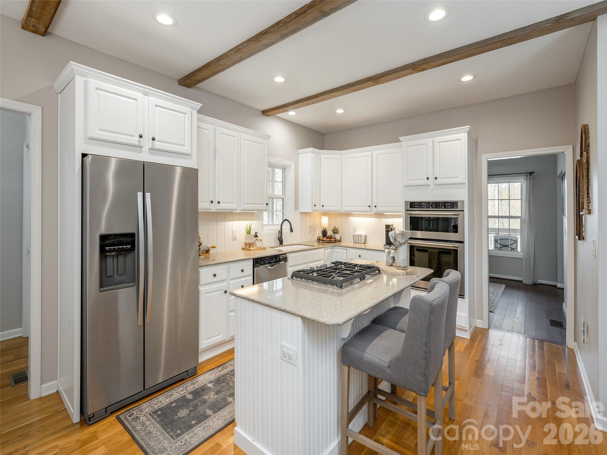417 Blue Mist Way Arden, NC 28704 - Photo 17 of 48 a kitchen with stainless steel appliances a stove a refrigerator and a refrigerator