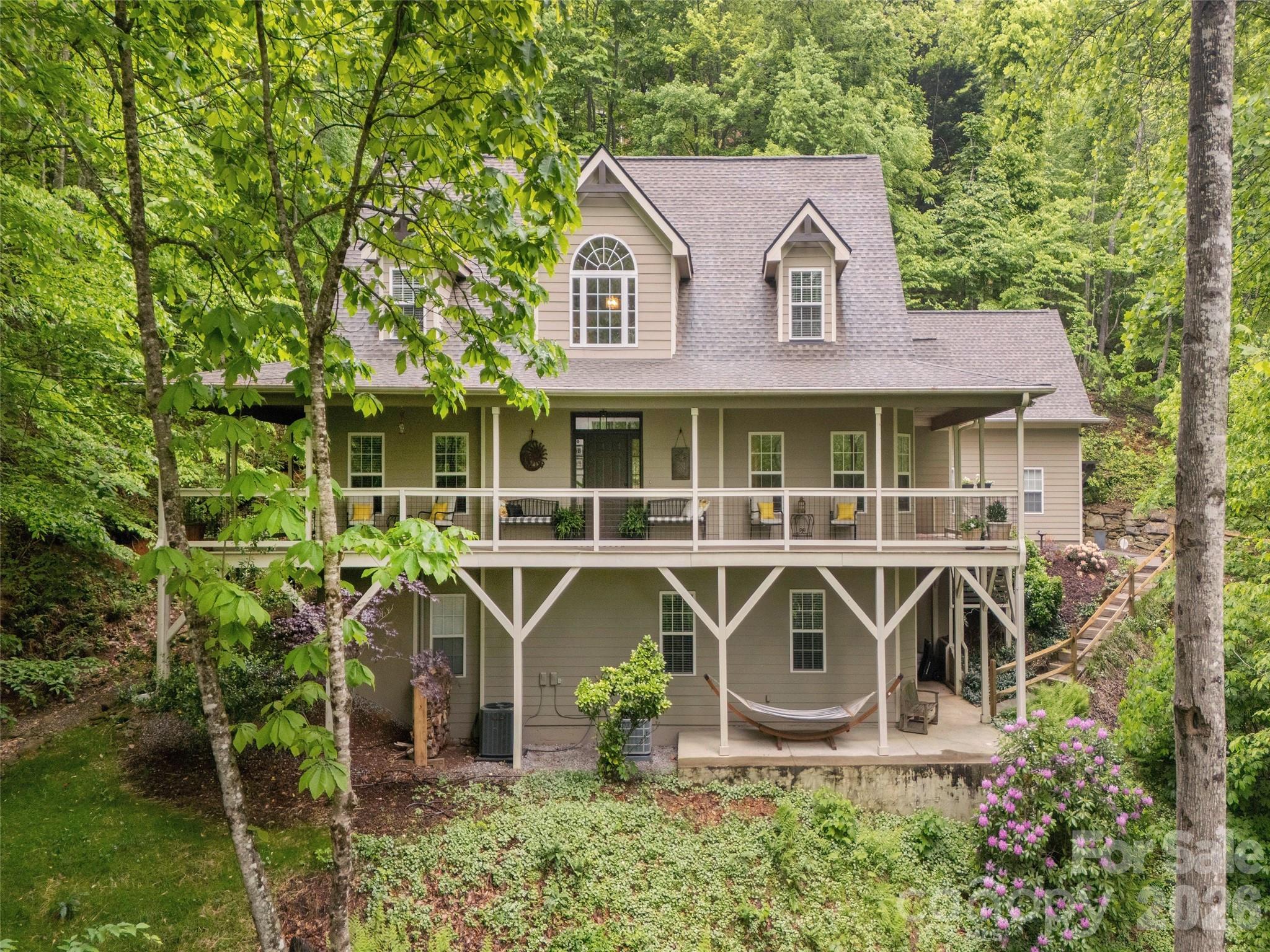 417 Blue Mist Way Arden, NC 28704 - Photo 2 of 48 a front view of a house with porch