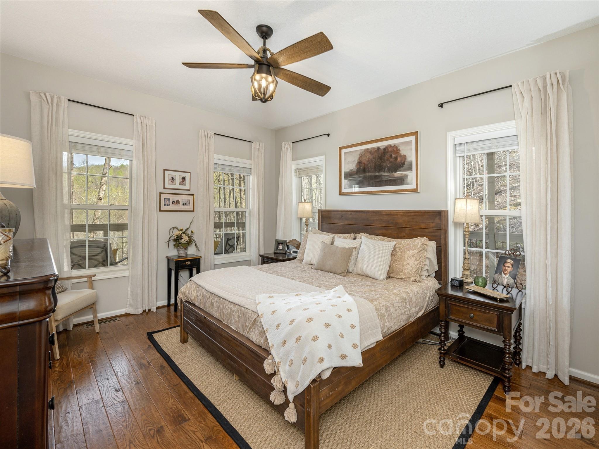 417 Blue Mist Way Arden, NC 28704 - Photo 24 of 48 a bedroom with a bed and a large window with wooden floor