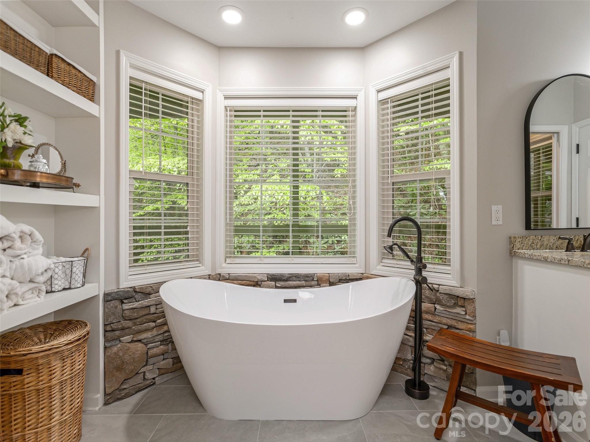 417 Blue Mist Way Arden, NC 28704 - Photo 28 of 48 a white bath tub sitting in a bathroom next to a window