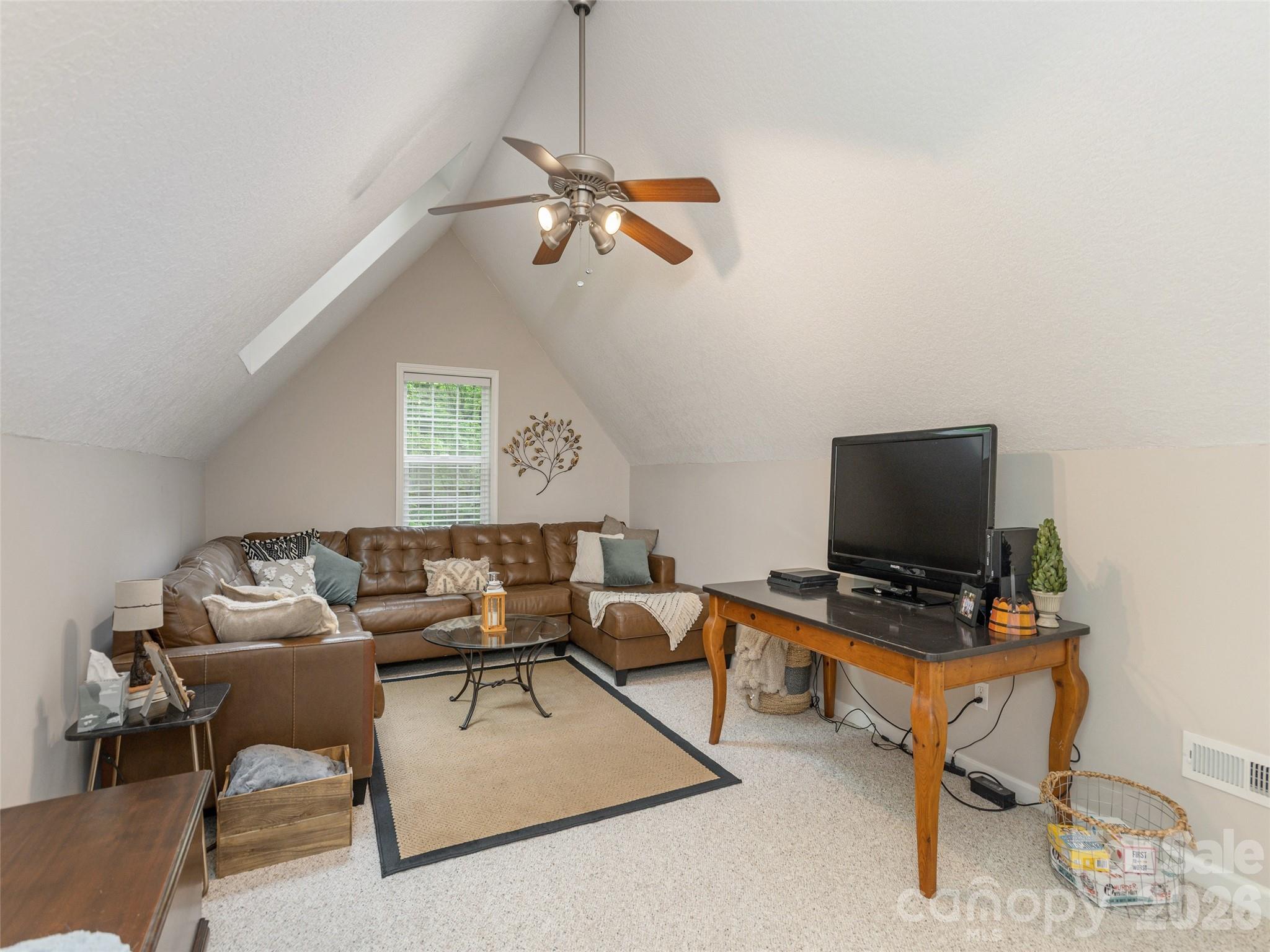 417 Blue Mist Way Arden, NC 28704 - Photo 34 of 48 a living room with furniture and a flat screen tv