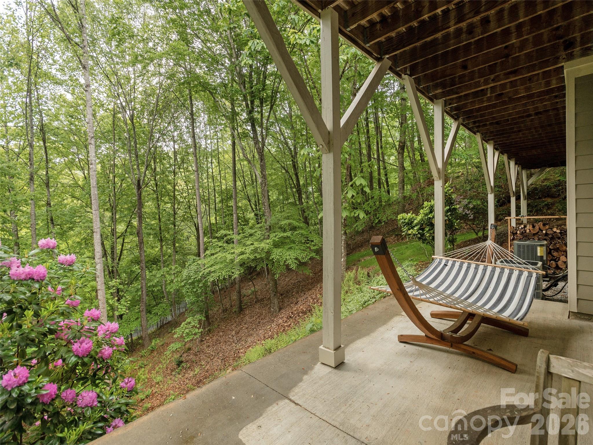 417 Blue Mist Way Arden, NC 28704 - Photo 38 of 48 a view of porch with a table chairs and a potted plant