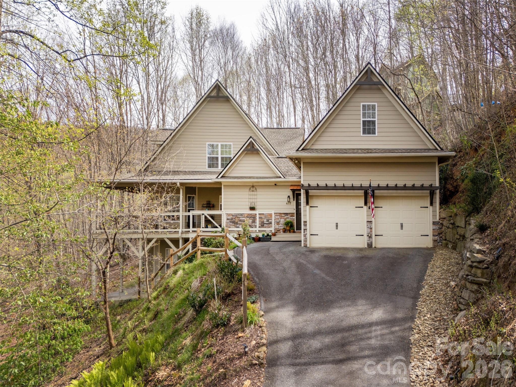 417 Blue Mist Way Arden, NC 28704 - Photo 39 of 48 a view of a house with a wooden fence and a trees