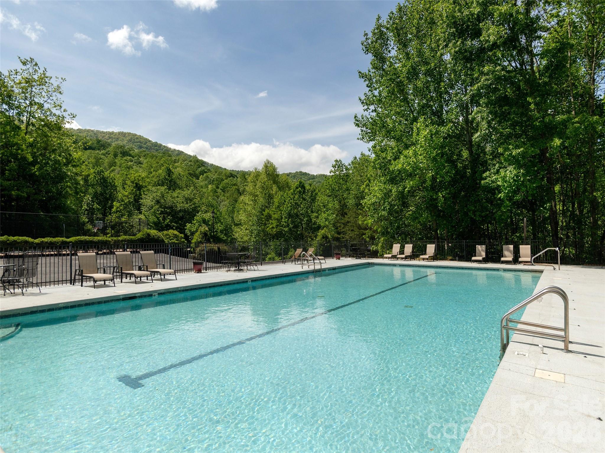 417 Blue Mist Way Arden, NC 28704 - Photo 45 of 48 a view of a swimming pool and lounge chairs
