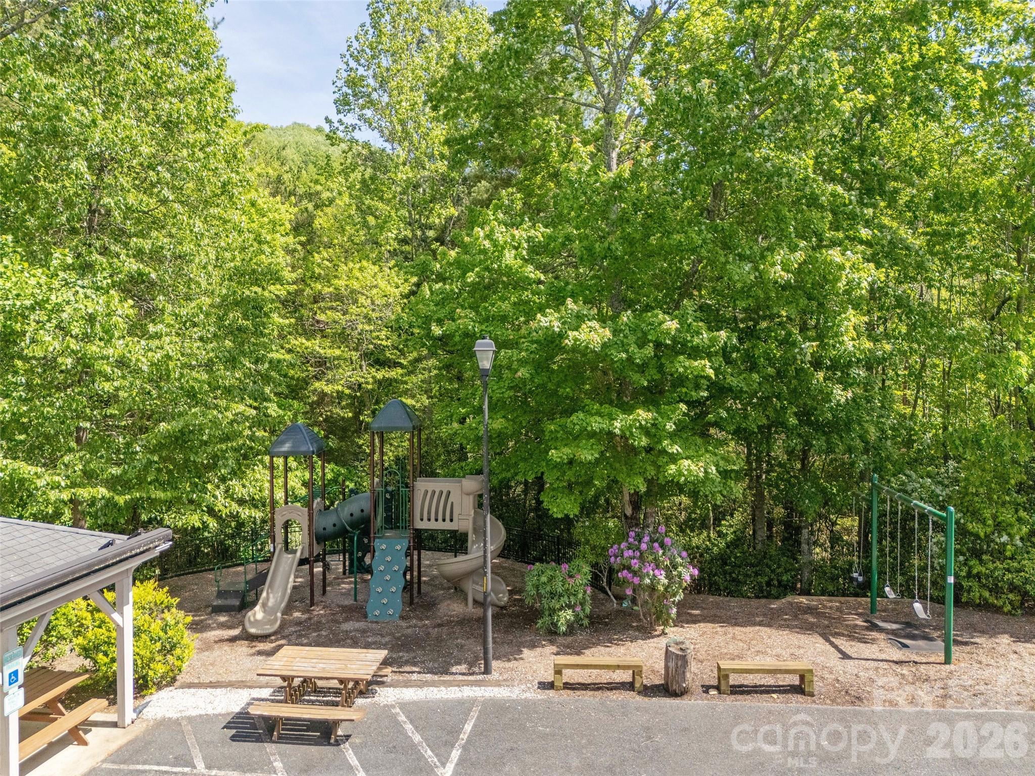 417 Blue Mist Way Arden, NC 28704 - Photo 47 of 48 a view of a patio with table and chairs and potted plants