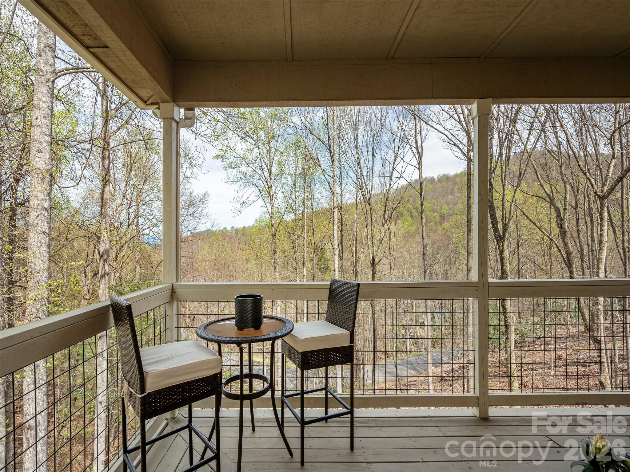 417 Blue Mist Way Arden, NC 28704 - Photo 5 of 48 a view of a large window with chairs and wooden floor