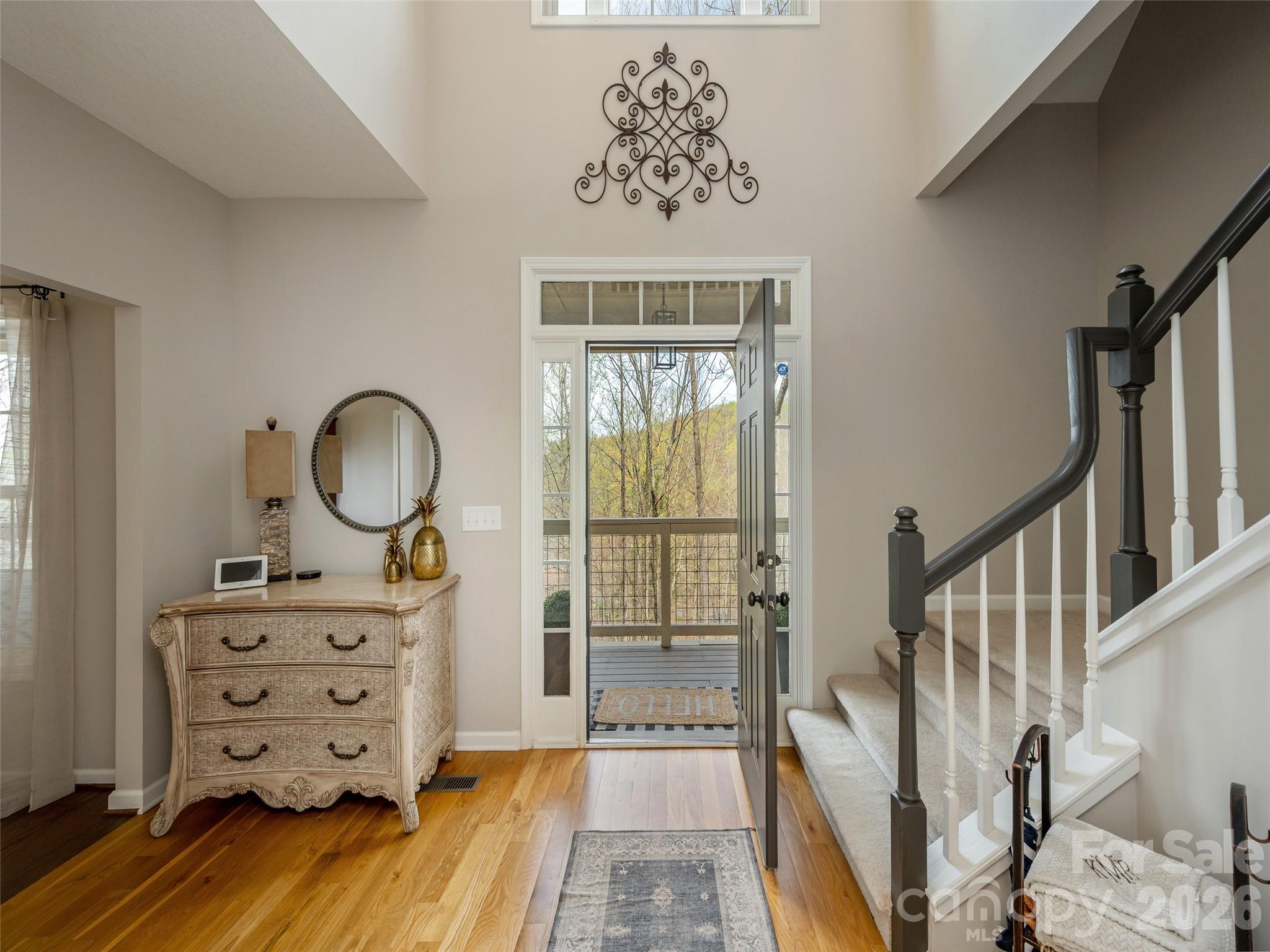 417 Blue Mist Way Arden, NC 28704 - Photo 8 of 48 a view of a hallway with wooden floor windows