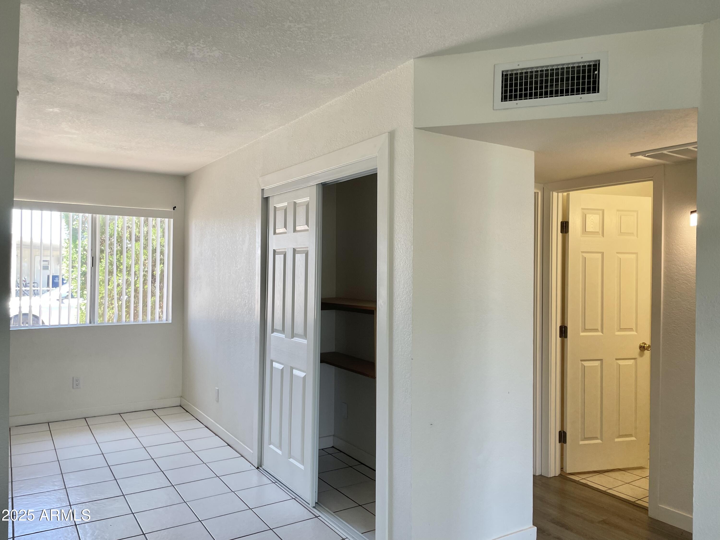 143 South Mountain Road Apache Junction, AZ 85120 - Photo 14 of 38 a view of an empty room and window
