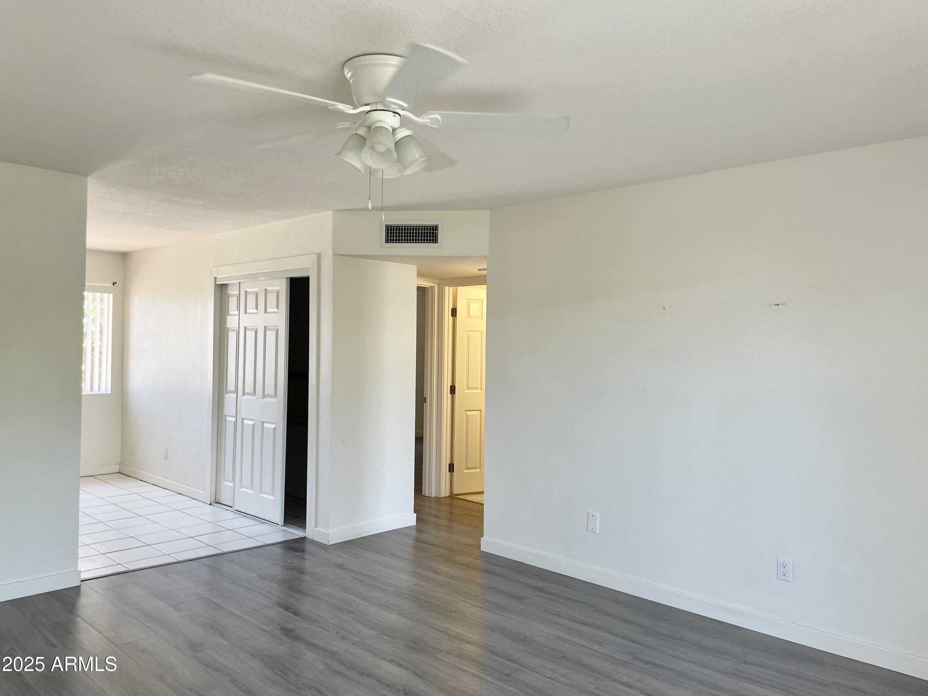 143 South Mountain Road Apache Junction, AZ 85120 - Photo 15 of 38 a view of an empty room with wooden floor