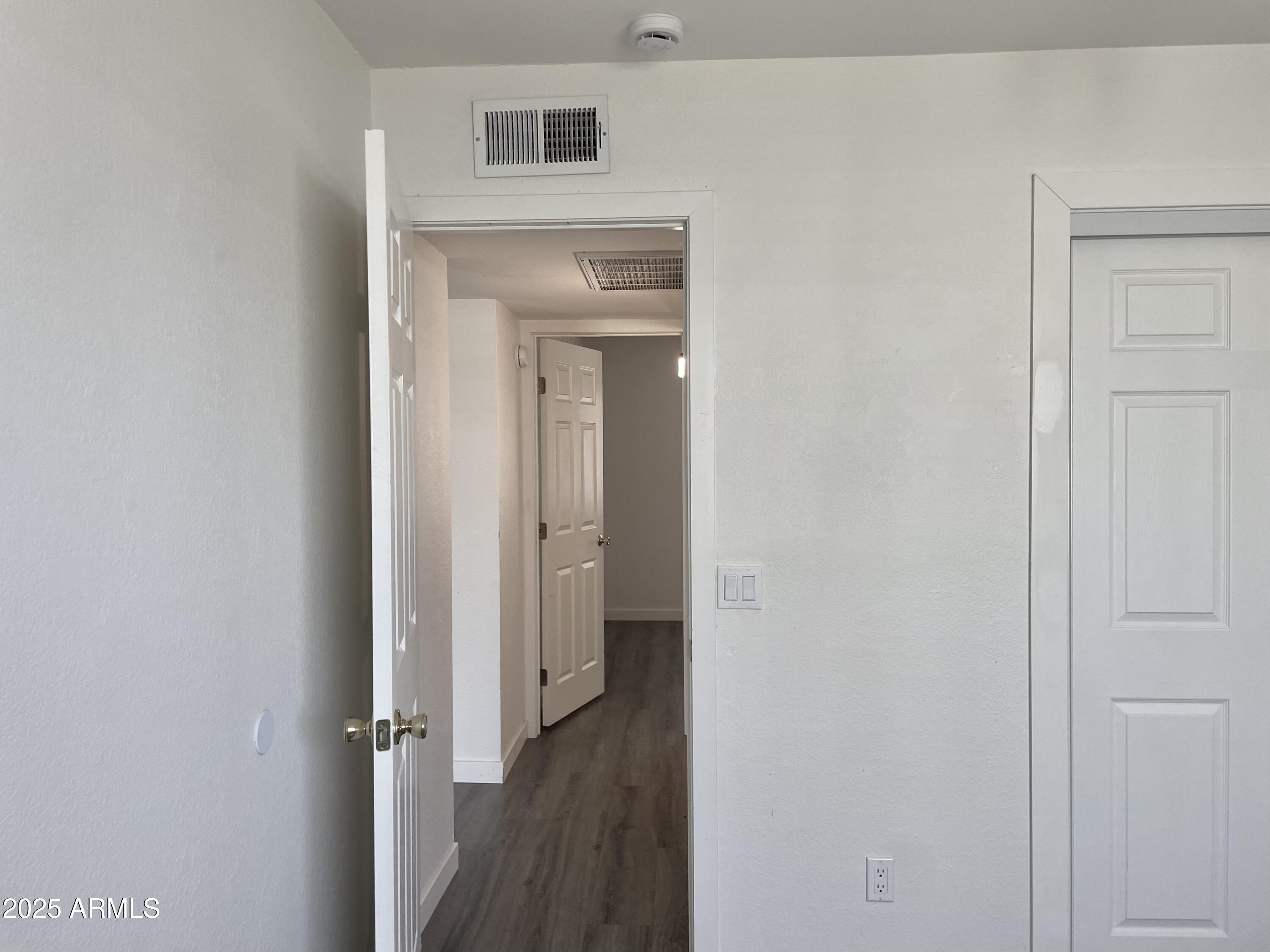 143 South Mountain Road Apache Junction, AZ 85120 - Photo 17 of 38 a view of a hallway with wooden floor