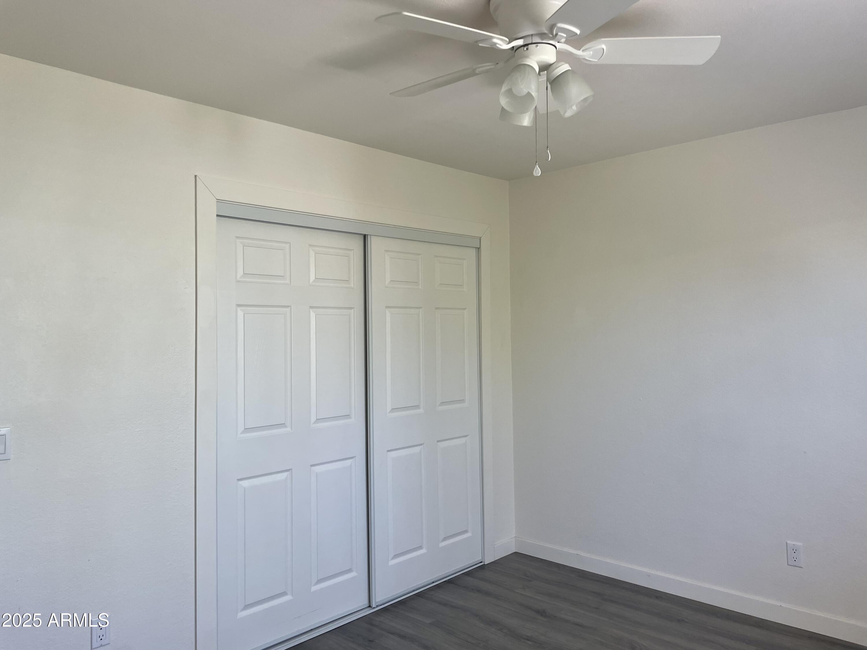 143 South Mountain Road Apache Junction, AZ 85120 - Photo 21 of 38 a view of an empty room with wooden floor