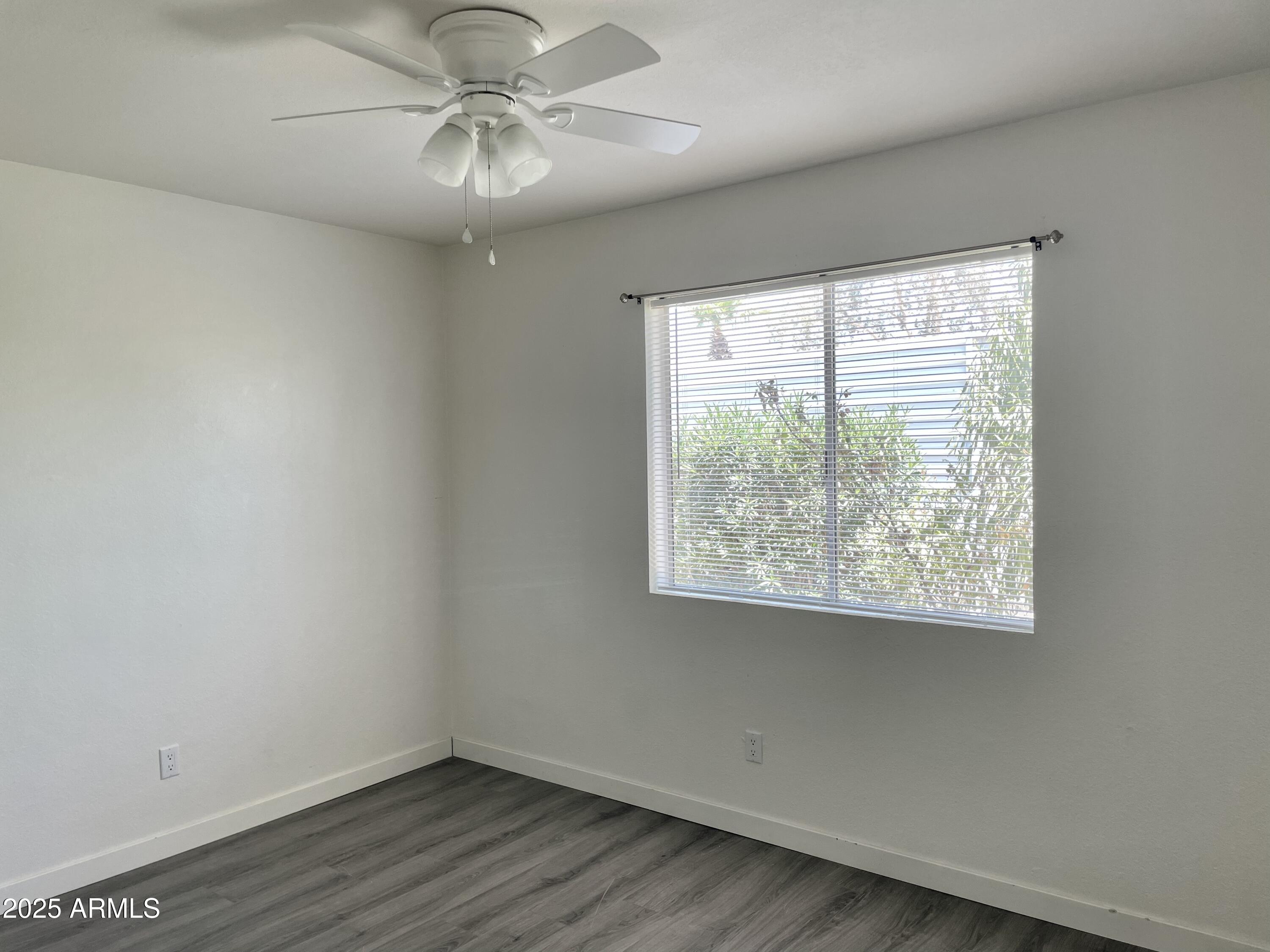 143 South Mountain Road Apache Junction, AZ 85120 - Photo 22 of 38 a view of a big room with wooden floor and windows