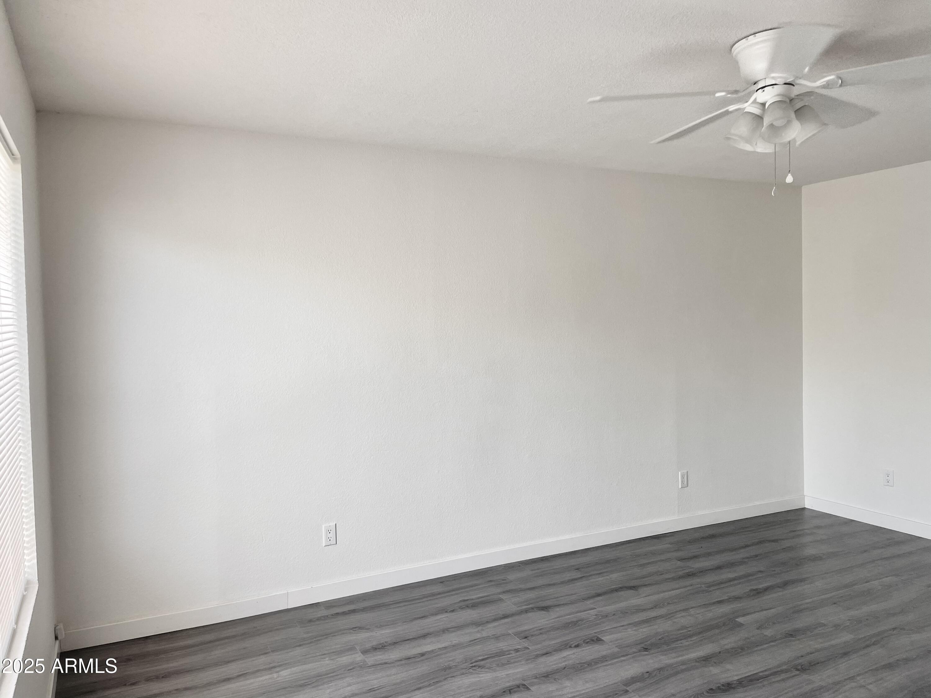 143 South Mountain Road Apache Junction, AZ 85120 - Photo 23 of 38 a view of an empty room with wooden floor