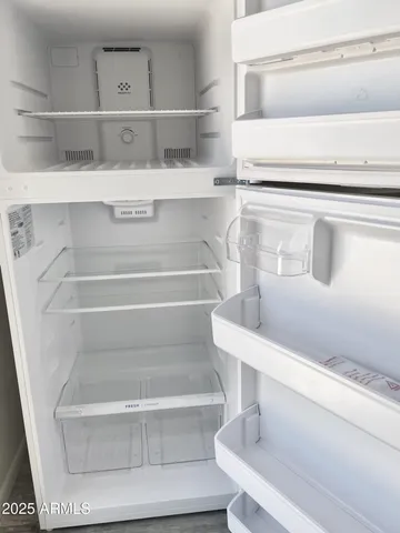 a view of a closet with wooden floor