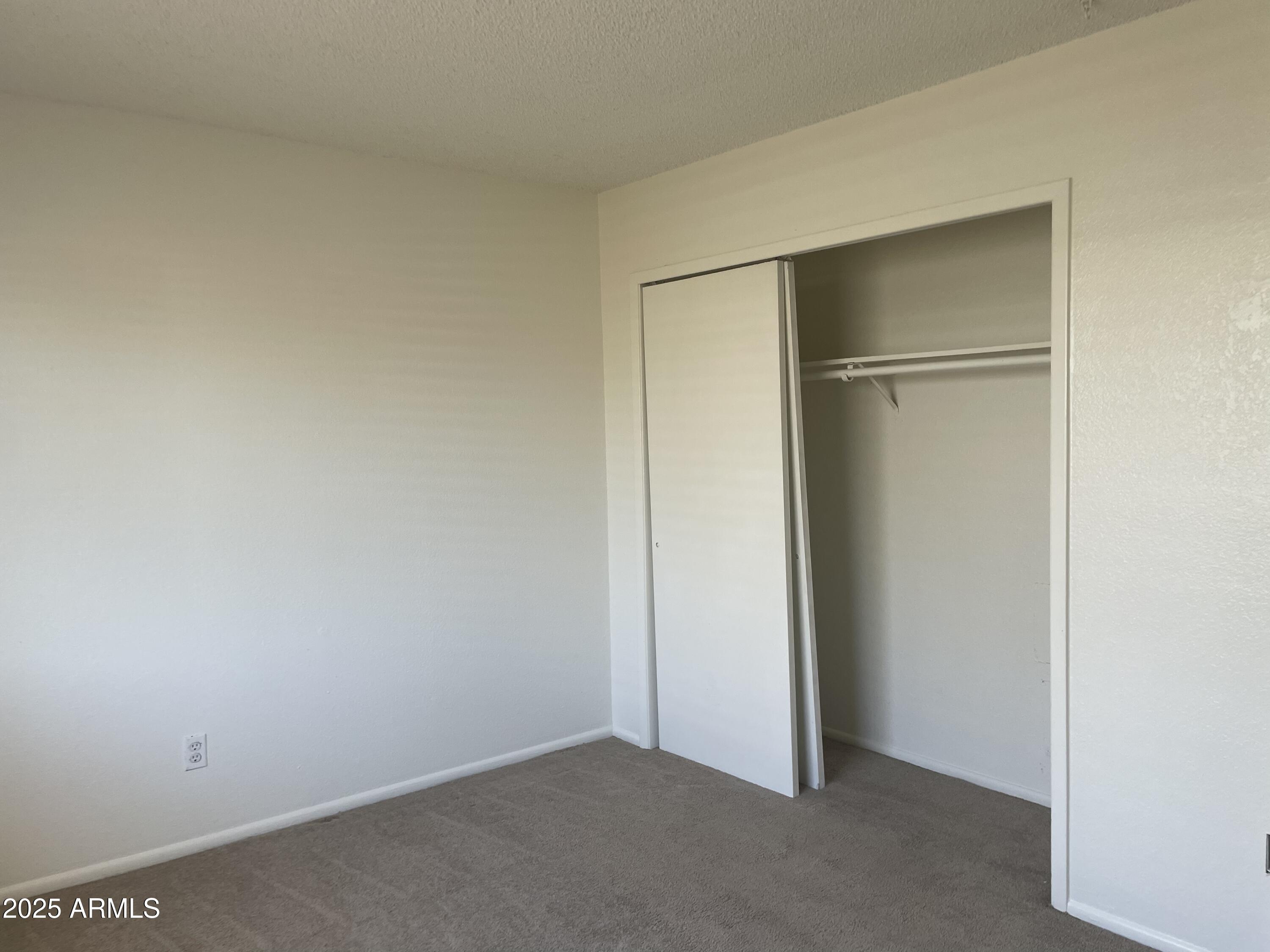 143 South Mountain Road Apache Junction, AZ 85120 - Photo 30 of 38 an empty room with closet area