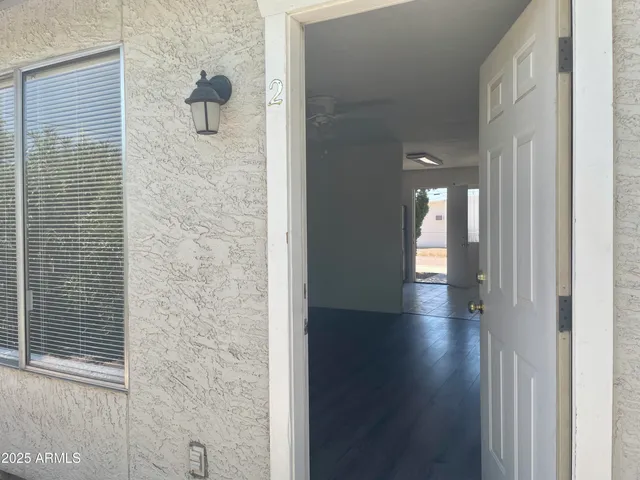 a view of a bathroom from the hallway