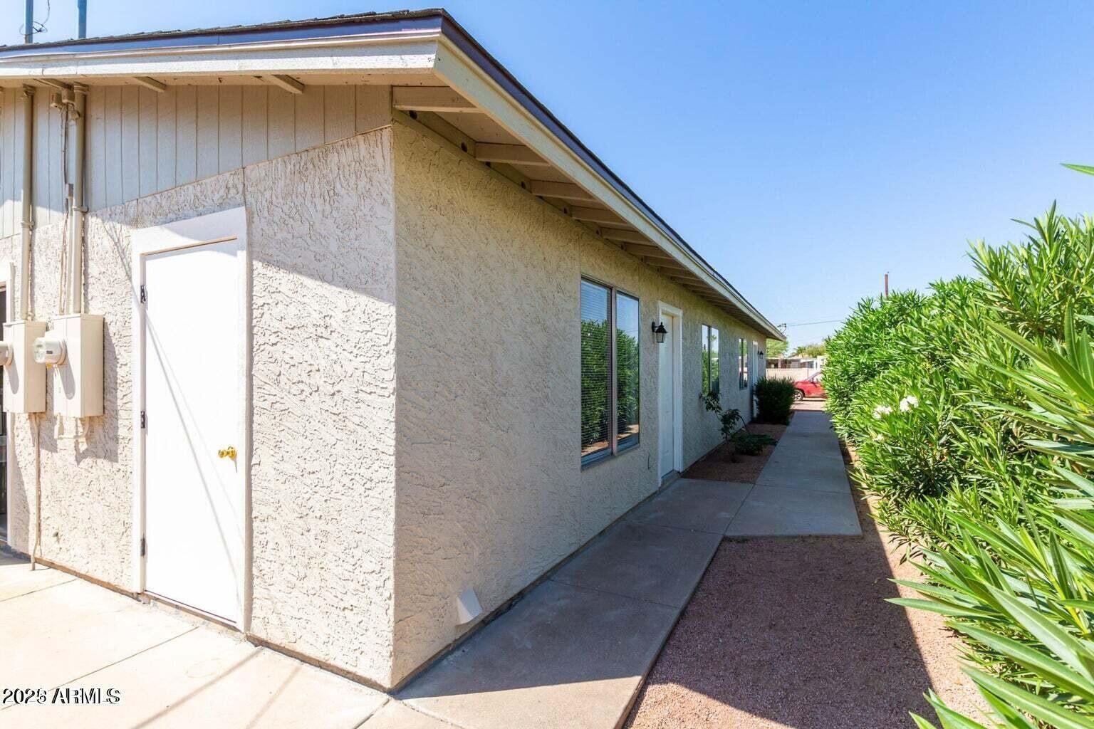 143 South Mountain Road Apache Junction, AZ 85120 - Photo 9 of 38 a view of a house with a backyard