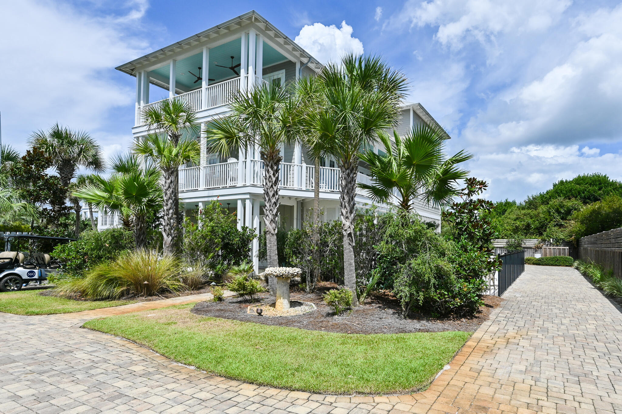 401 Blue Mountain Road Santa Rosa Beach, FL 32459 - Photo 2 of 60 a front view of a house with garden