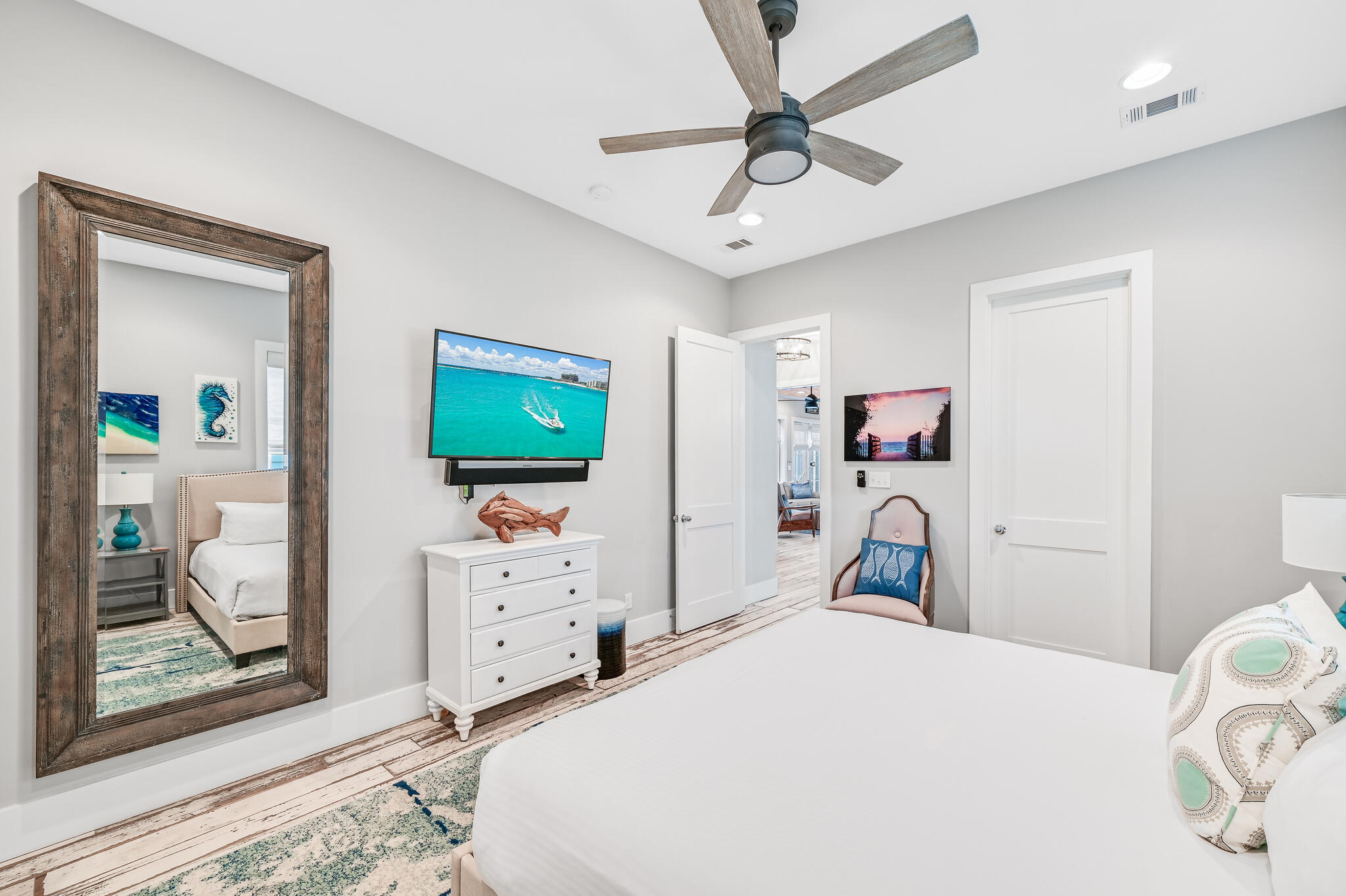 401 Blue Mountain Road Santa Rosa Beach, FL 32459 - Photo 54 of 60 a bedroom with a bed and a flat tv screen on dresser