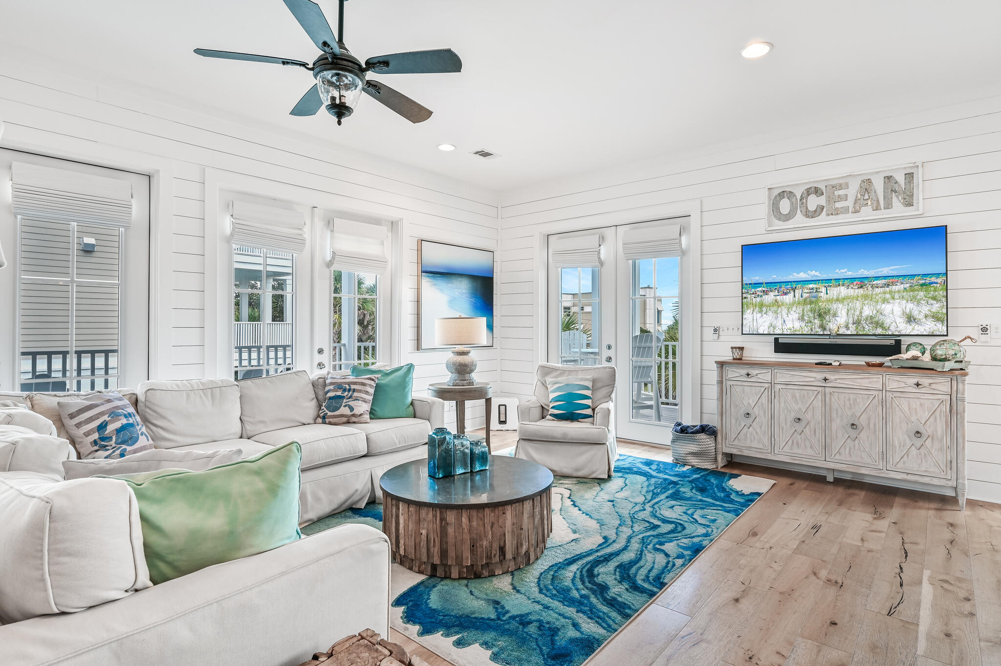 401 Blue Mountain Road Santa Rosa Beach, FL 32459 - Photo 6 of 60 a living room with furniture and a kitchen view