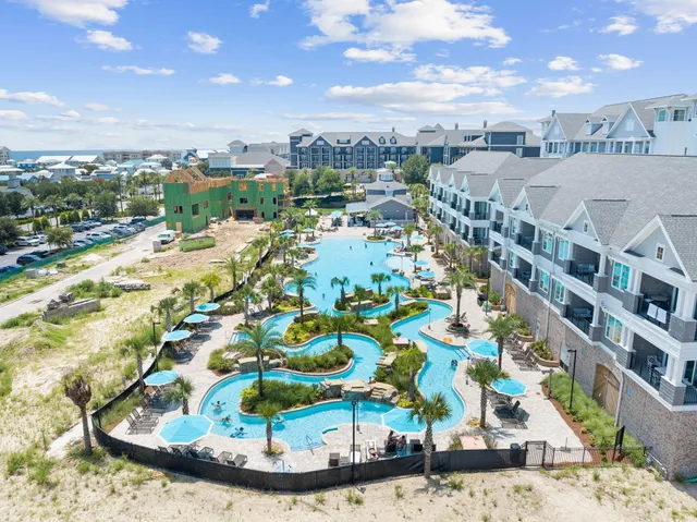a view of a swimming pool with an outdoor seating