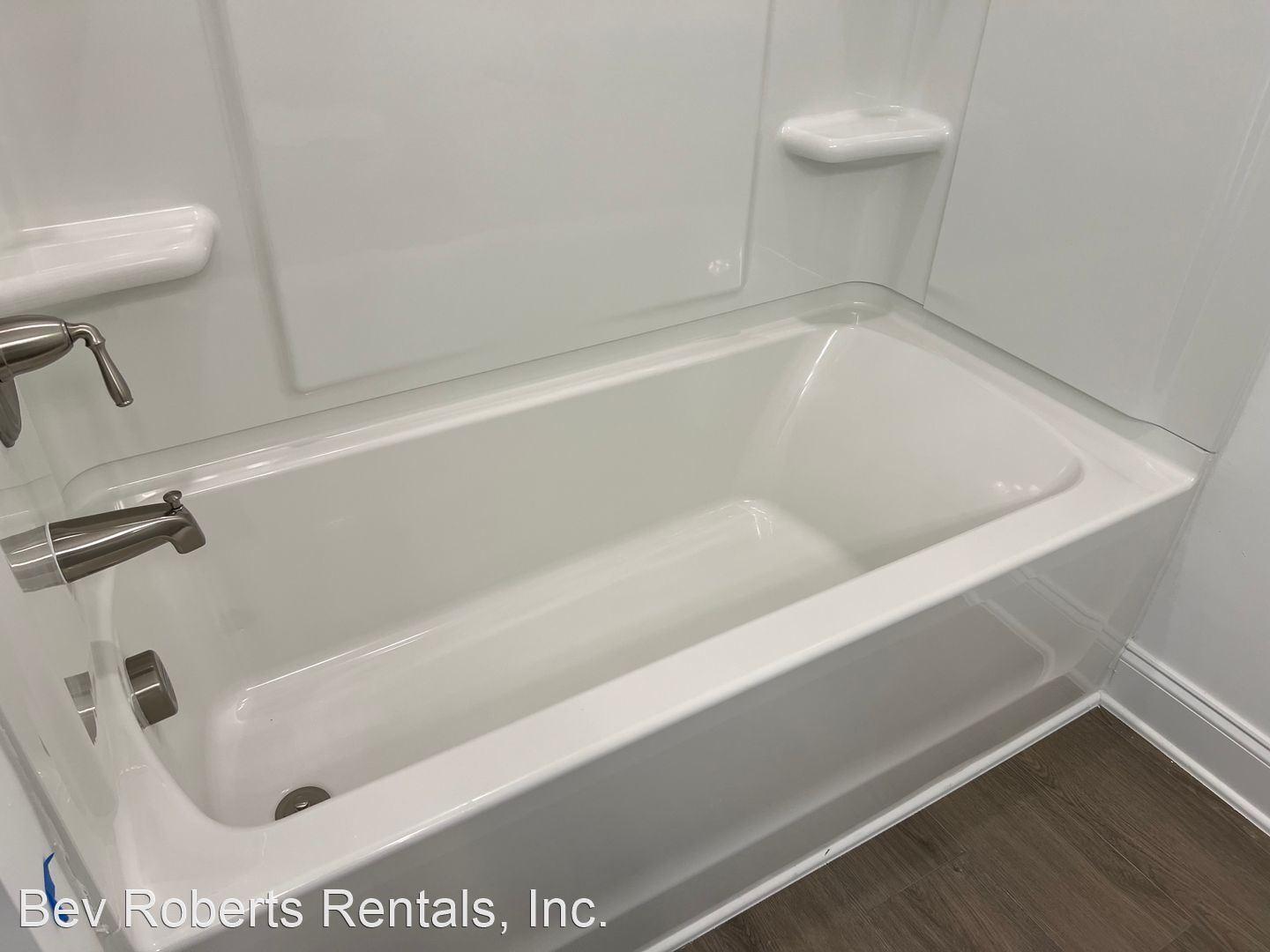 2104 Stegemann Street Apex, NC 27502 - Photo 17 of 29 a bathroom with a bathtub