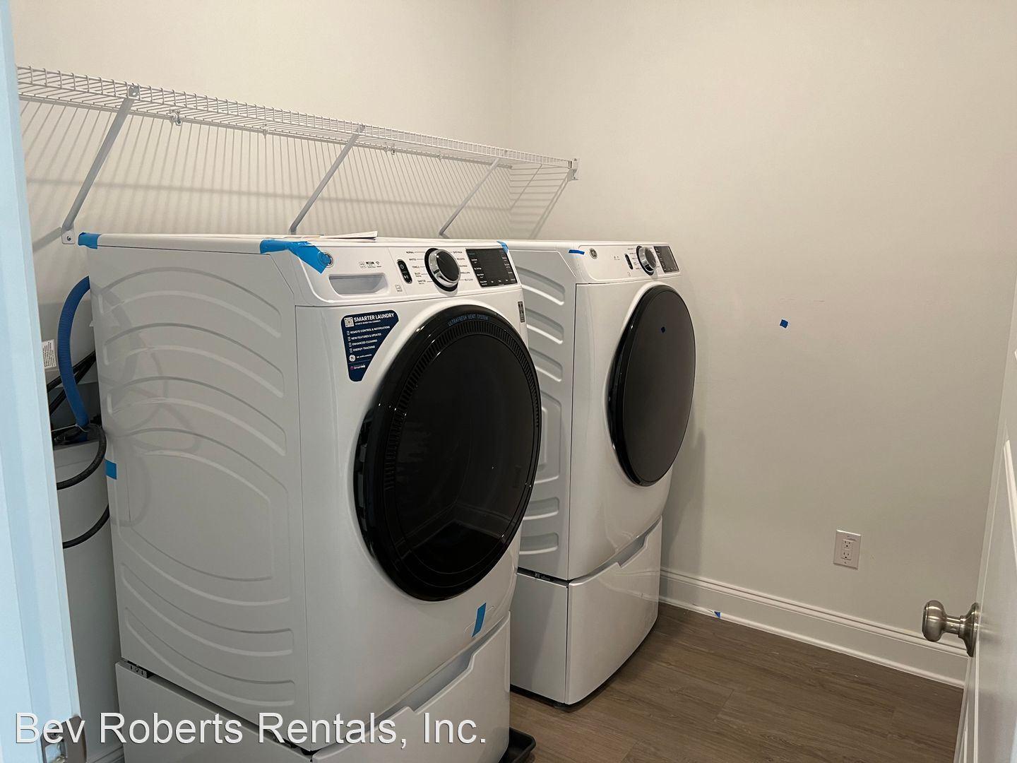 2104 Stegemann Street Apex, NC 27502 - Photo 21 of 29 a utility room with dryer and washer