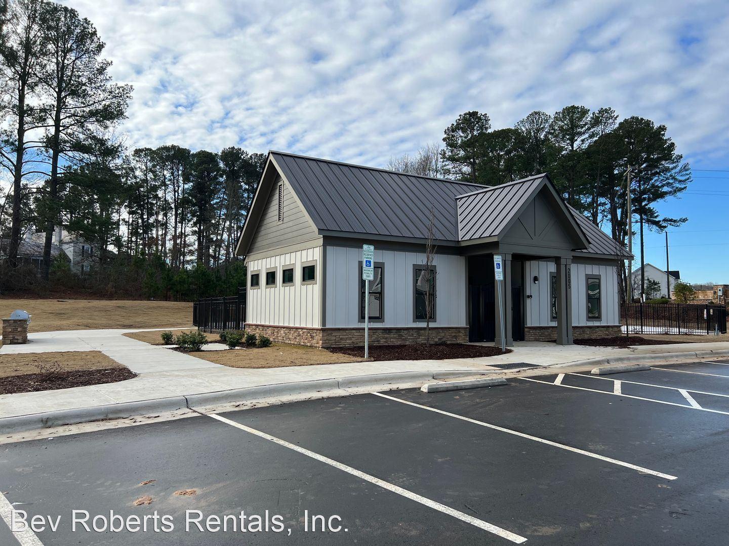 2104 Stegemann Street Apex, NC 27502 - Photo 27 of 29 a view of a house with street that has a lots of car parked on it