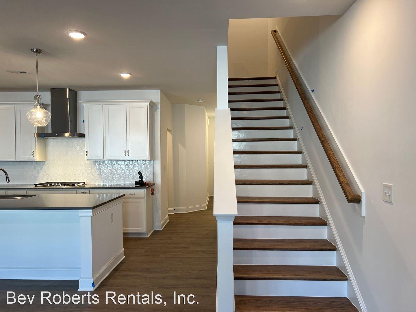 2104 Stegemann Street Apex, NC 27502 - Photo 10 of 29 a kitchen with a sink and cabinets