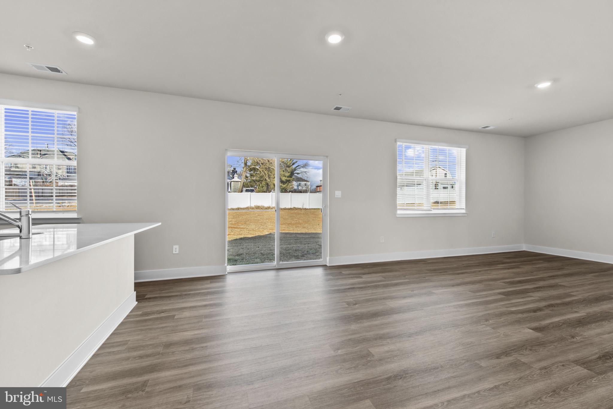 224 Eclipse Street Ranson, WV 25438 - Photo 8 of 41 an empty room with wooden floor and windows