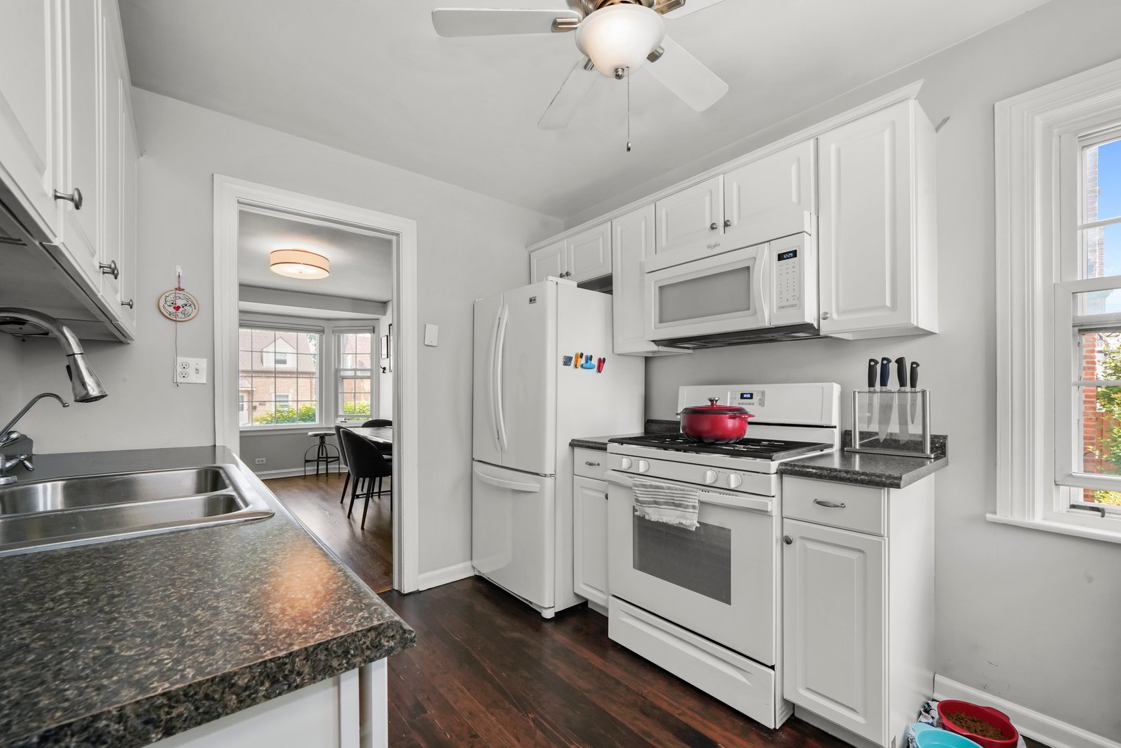 7801 West Victoria Street Chicago, IL 60631 - Photo 11 of 30 a kitchen with stainless steel appliances granite countertop a stove and a sink