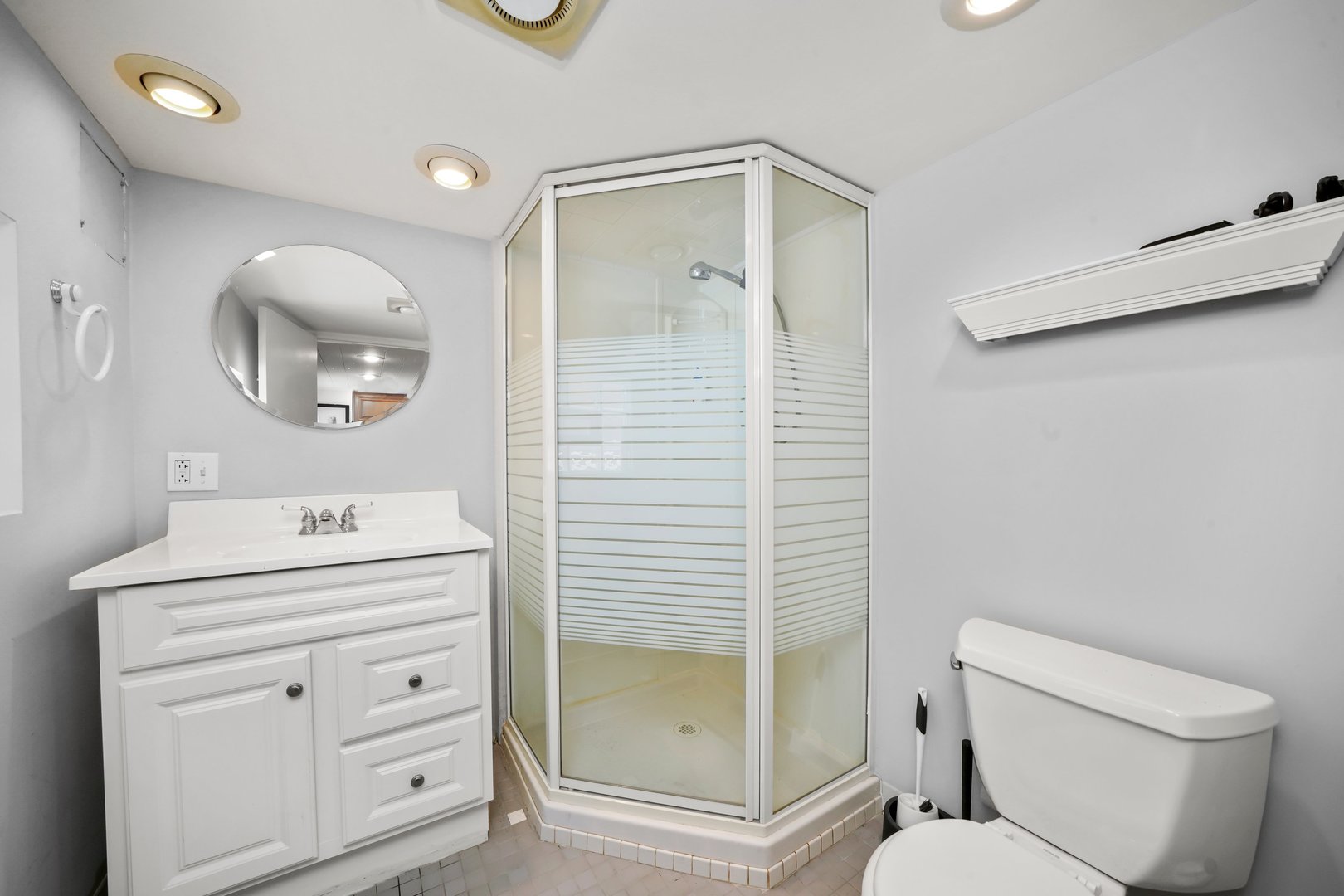 7801 West Victoria Street Chicago, IL 60631 - Photo 20 of 30 a bathroom with a sink a toilet and shower