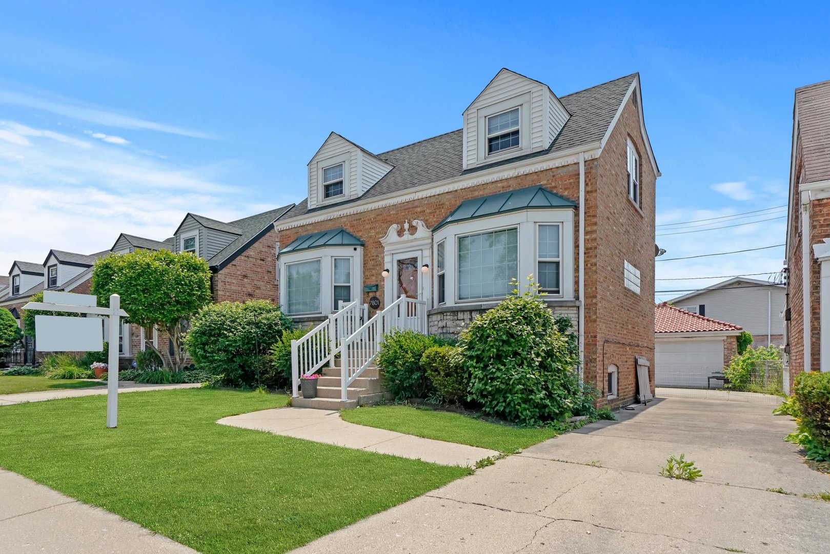 7801 West Victoria Street Chicago, IL 60631 - Photo 2 of 30 a front view of a house with a yard
