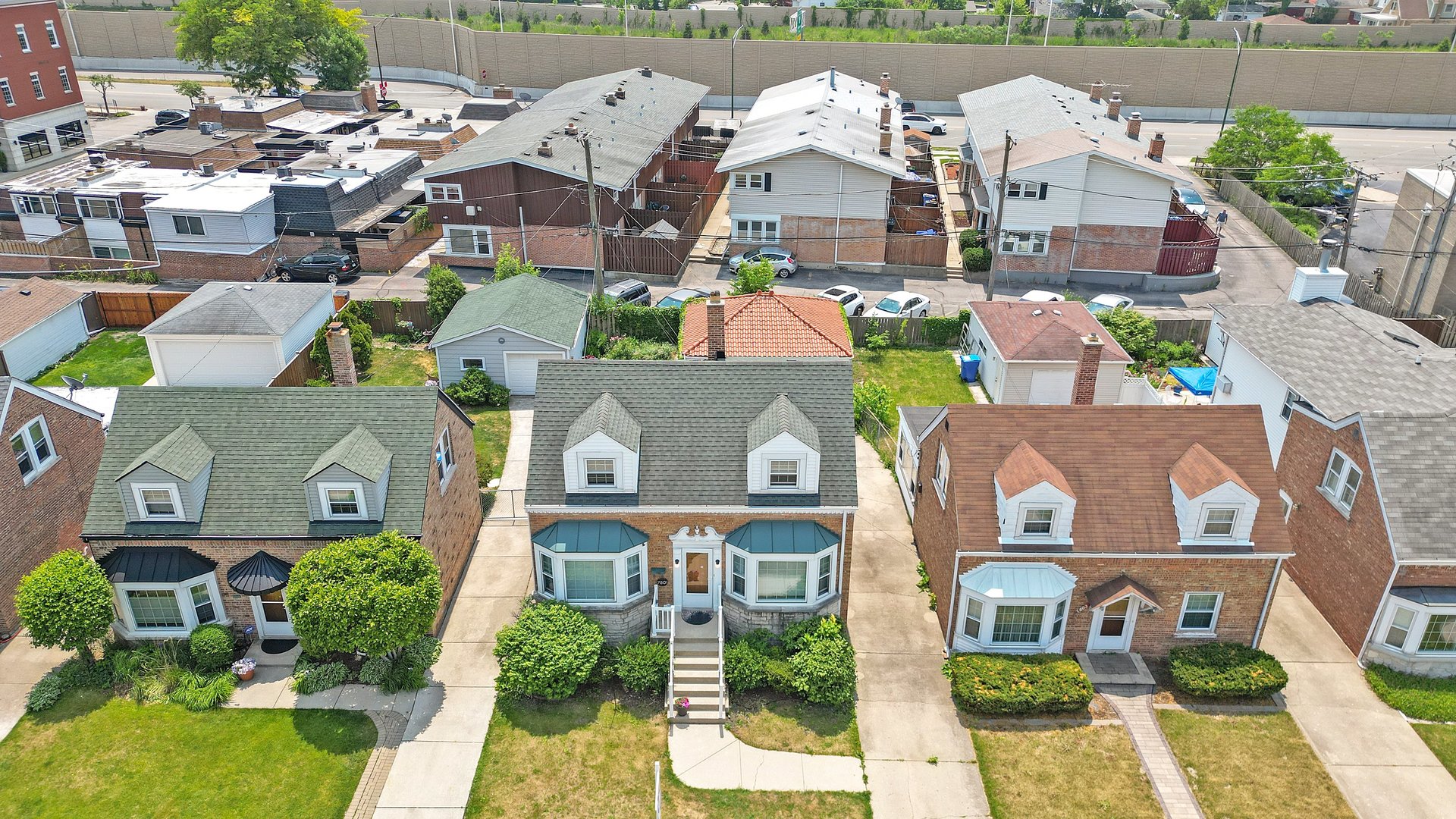 7801 West Victoria Street Chicago, IL 60631 - Photo 25 of 30 an aerial view of multiple houses with yard