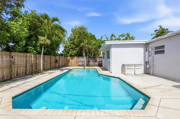 a view of swimming pool with seating space