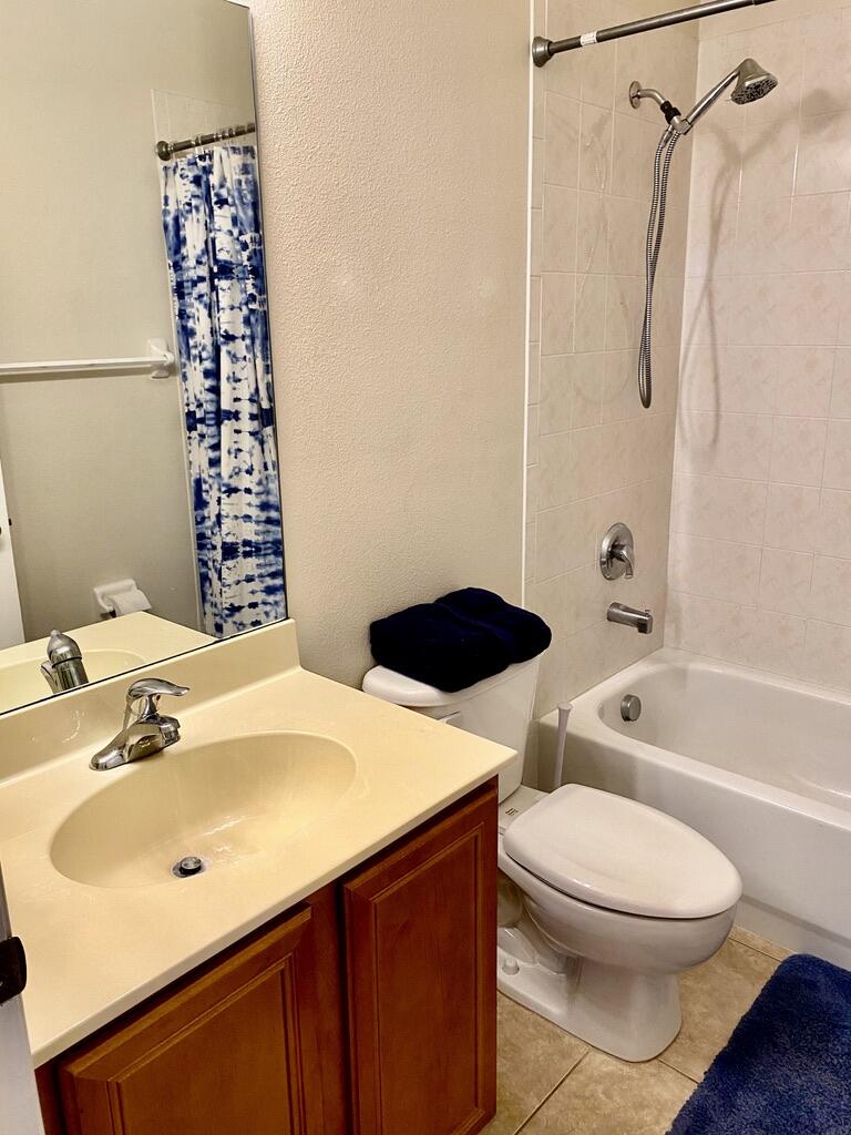 4751 Chardonnay Drive Rockledge, FL 32955 - Photo 17 of 25 a bathroom with a sink a toilet and shower