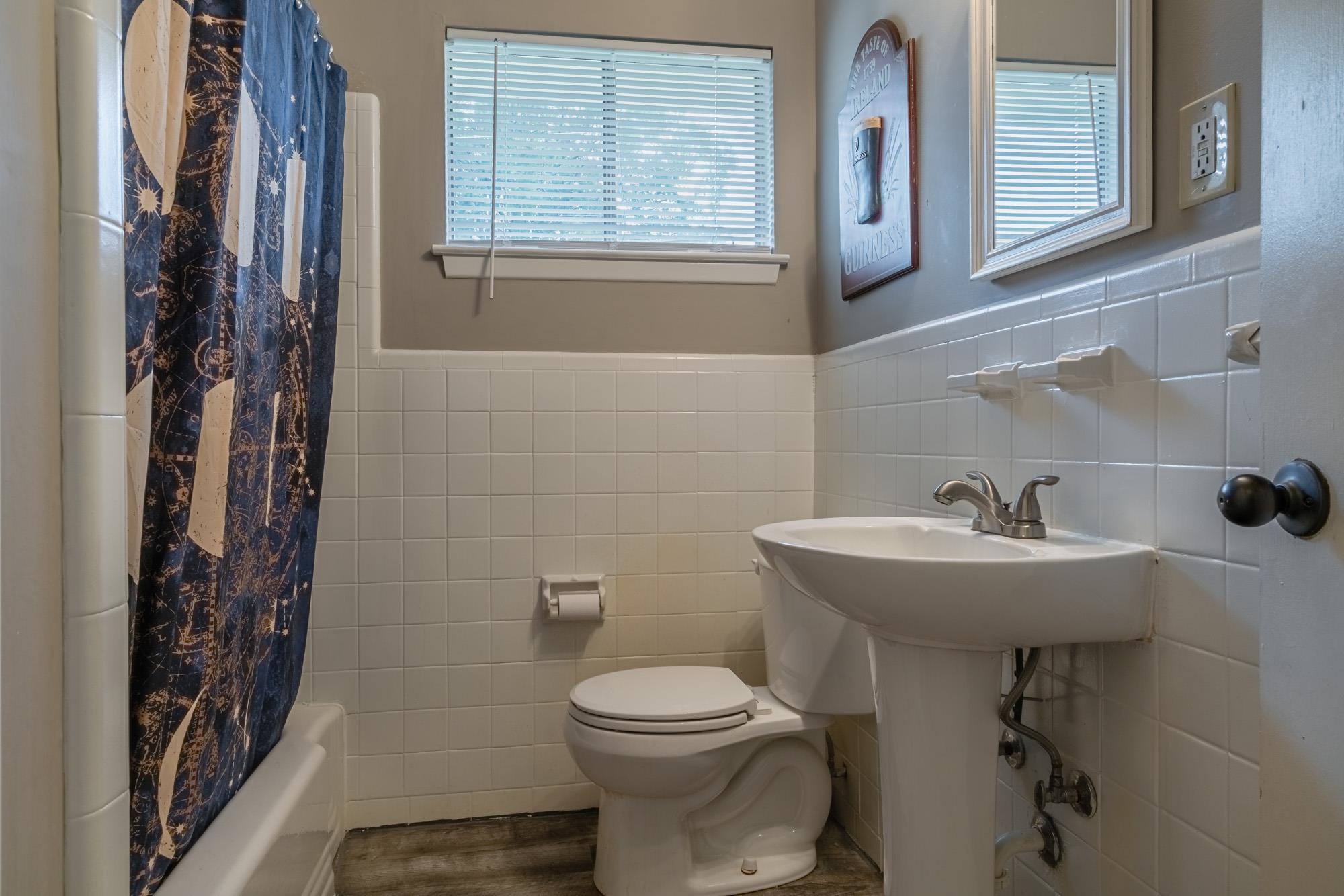 5356 Quince Road Memphis, TN 38119 - Photo 12 of 21 a bathroom with a sink mirror and toilet