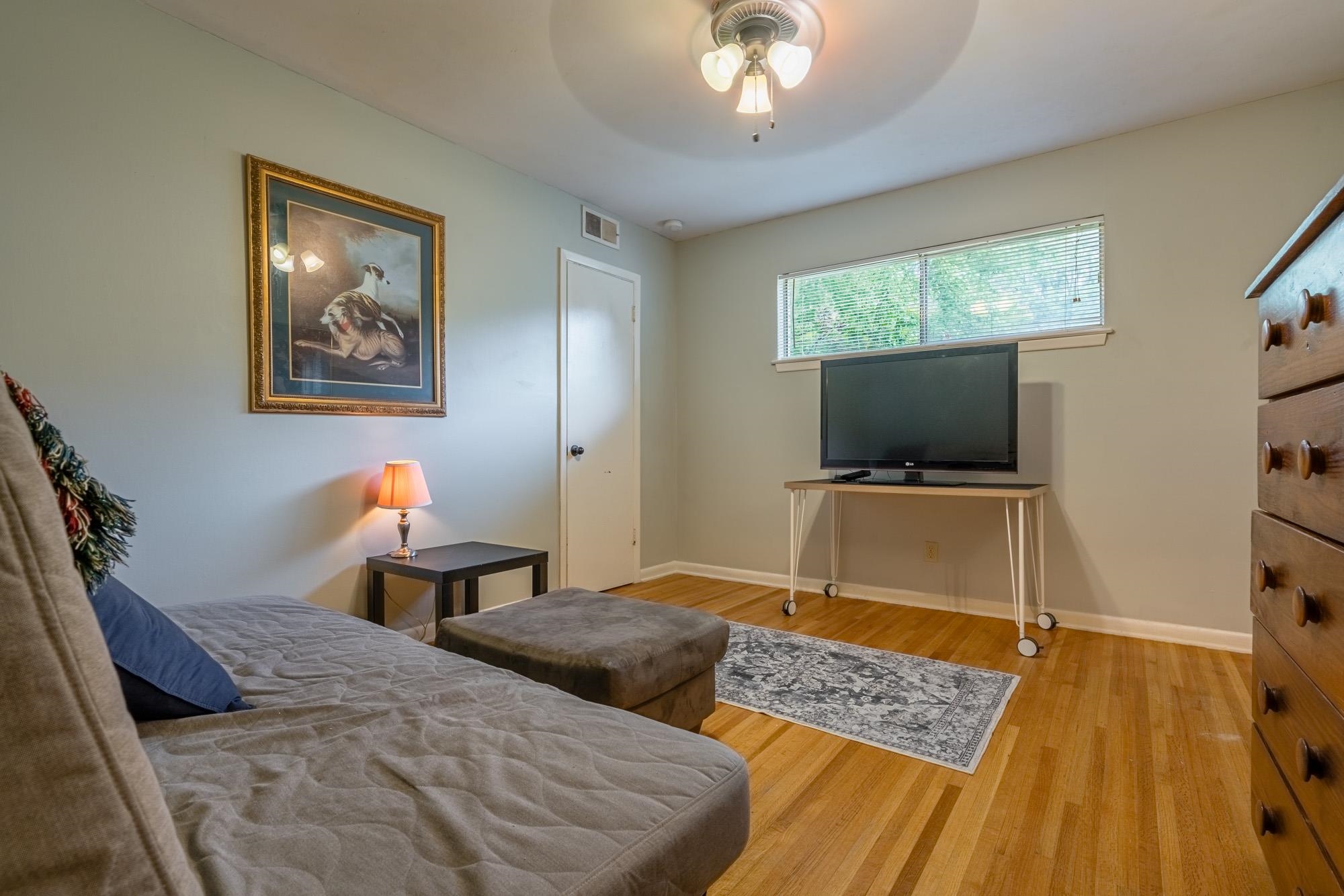 5356 Quince Road Memphis, TN 38119 - Photo 16 of 21 a bedroom with bed and a flat screen tv