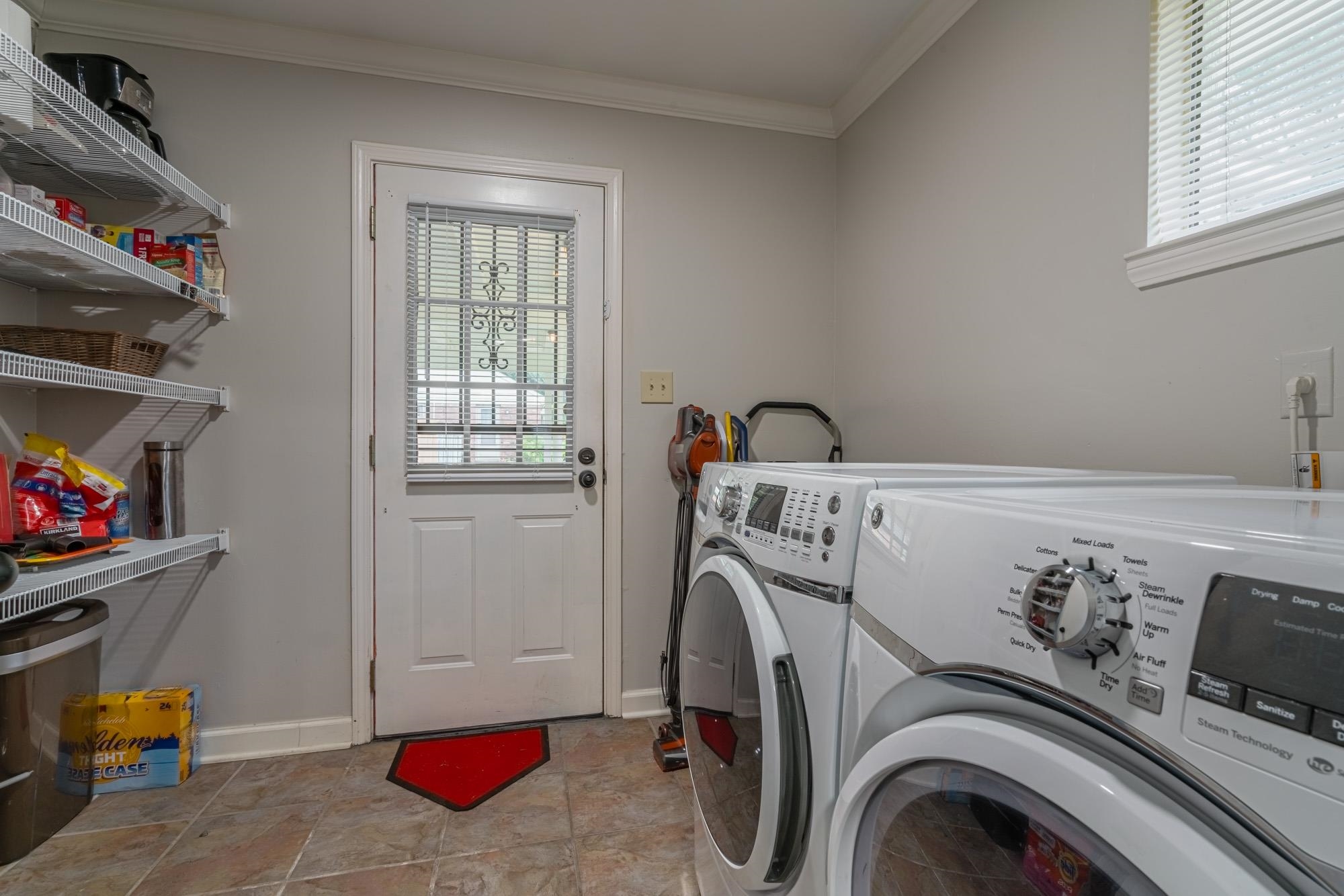 5356 Quince Road Memphis, TN 38119 - Photo 17 of 21 a utility room with dryer and washer
