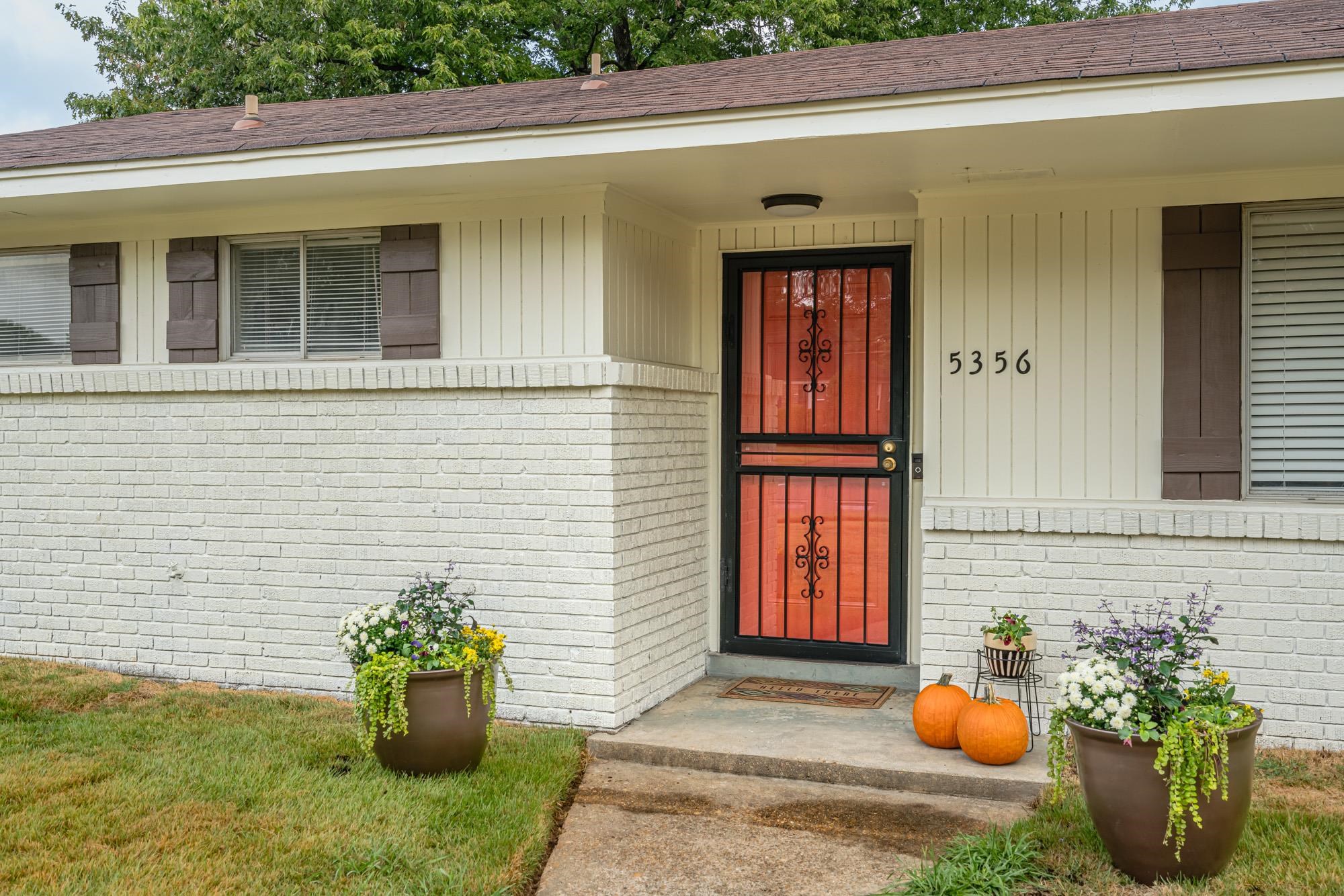5356 Quince Road Memphis, TN 38119 - Photo 2 of 21 a front view of a house with outdoor seating