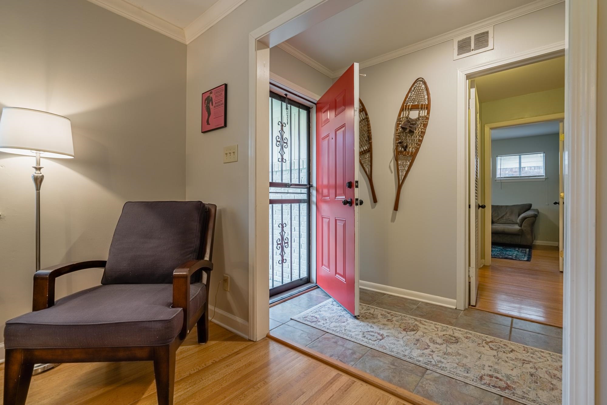 5356 Quince Road Memphis, TN 38119 - Photo 3 of 21 a view of a hallway with furniture and a rug