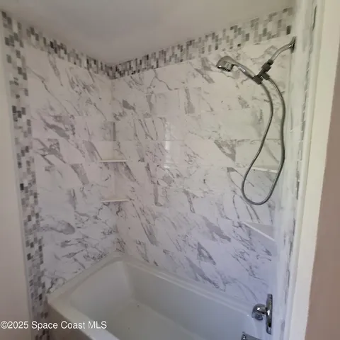 a bathroom with a shower curtain