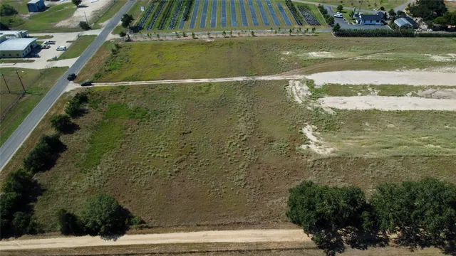 a view of a field with an ocean